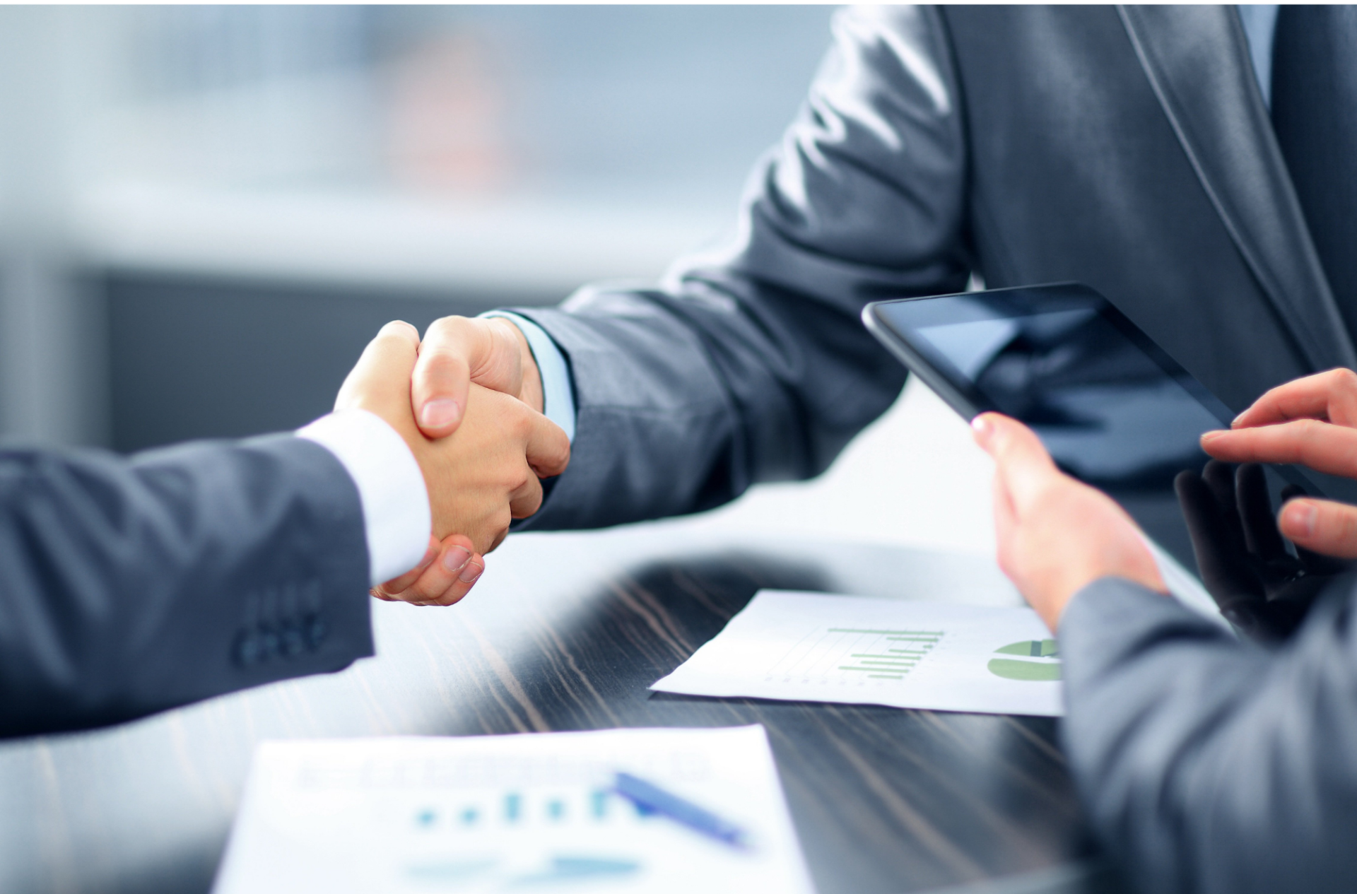 Two men shaking hands for a deal