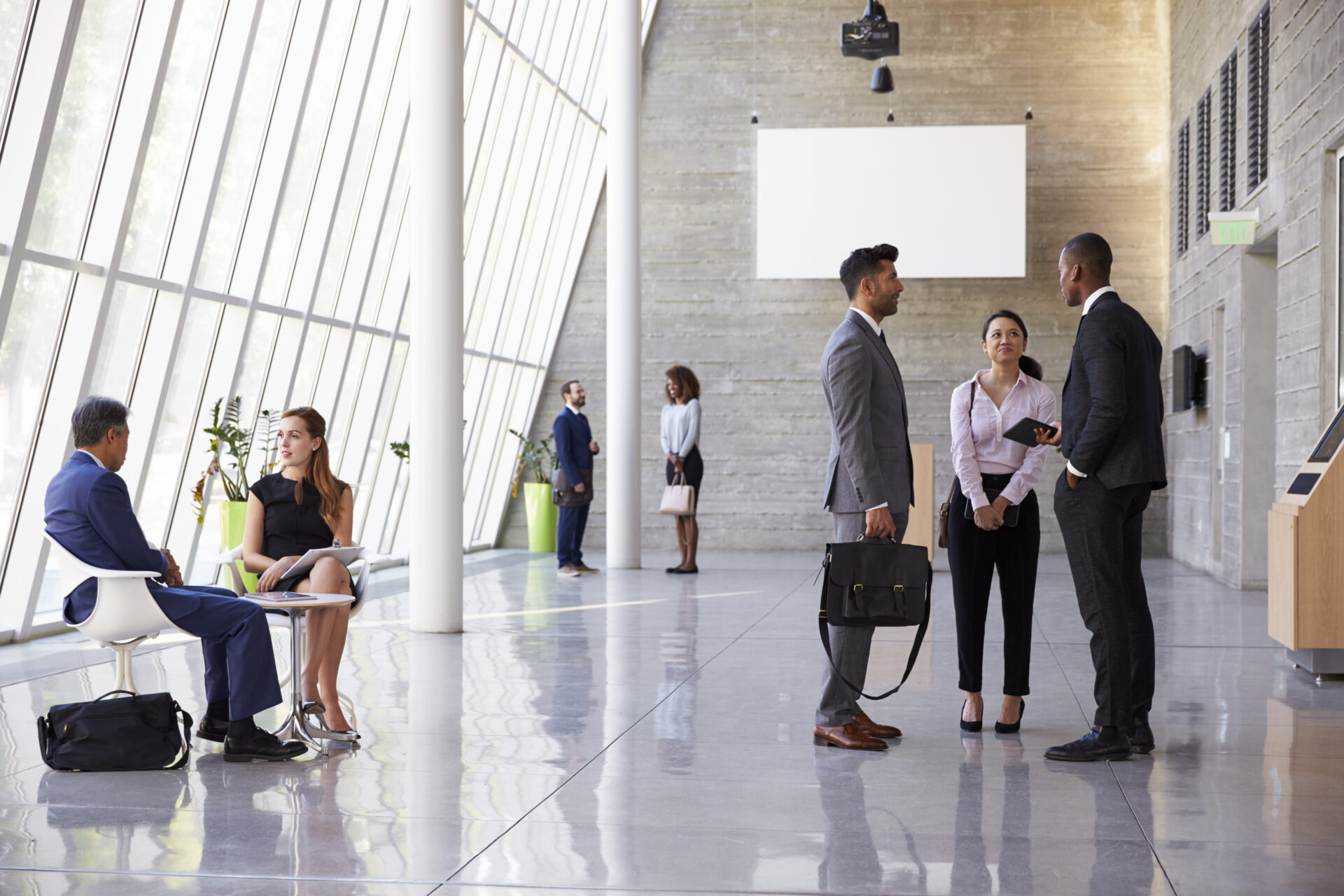 DAS in-building solutions for busy office foyer area with business people